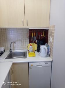 A kitchen or kitchenette at "By The Sea" Family apartments