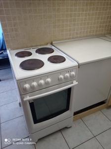 A kitchen or kitchenette at "By The Sea" Family apartments