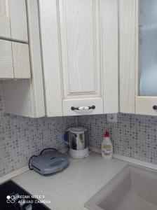 A kitchen or kitchenette at "By The Sea" Family apartments