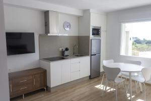 Kuchyň nebo kuchyňský kout v ubytování Alén de Louro - Apartamento 2 Area Maior + 11 fotografií