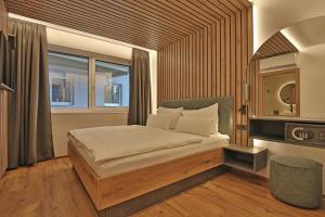 Postel nebo postele na pokoji v ubytování Das Goldjuwel - Luxury Apartments with private Spa + 37 fotografií