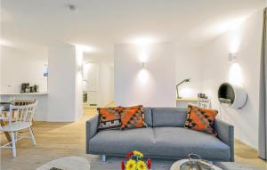 a living room with a couch and a table at Penthouse Deluxe in Lembruch