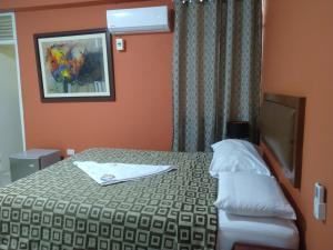Katil atau katil-katil dalam bilik di Hotel Perú Hosting - Piura
