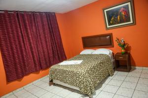 Katil atau katil-katil dalam bilik di Hotel Perú Hosting - Piura