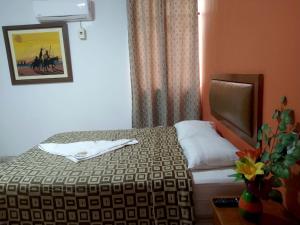 Katil atau katil-katil dalam bilik di Hotel Perú Hosting - Piura