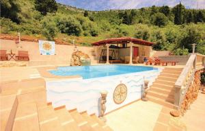 a swimming pool with a staircase next to a house at Pet Friendly Home In Cara in Čara +45 photos