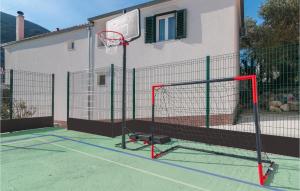 a basketball hoop in front of a house at 10 Bedroom Beautiful Home In Kucice in Kučiće +58 photos