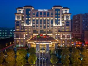 a view of the mgm grand hotel at night at Marco Polo Jin Jiang in Jinjiang