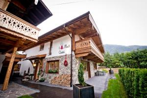 a building with a sign on the side of it at Superior Chalet Tiroler Madl in Achenkirch