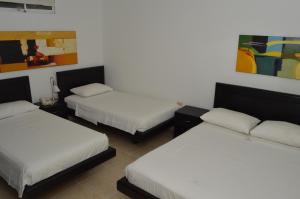 Cama o camas de una habitación en Colombia Real Hotel