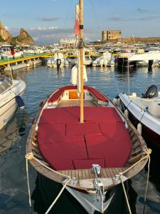 a boat is docked in the water with other boats at B&B DieMme Amalfi Coast in Vietri sul Mare