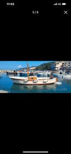 two boats are docked on the water in a harbor at B&B DieMme Amalfi Coast in Vietri sul Mare