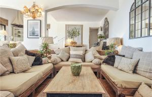 a living room with couches and a table at Awesome Home In Les Adrets D L'estérel in St Jean de l’Esterel