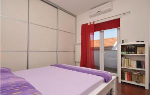 Postel nebo postele na pokoji v ubytování Apartment Supetar Ive Vojnovica