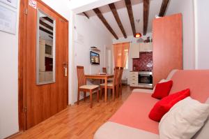 a living room with a couch and a table at Studios Anna in Rovinj