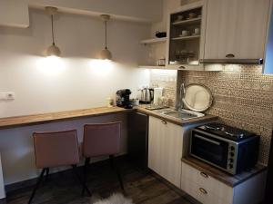 Kuchyň nebo kuchyňský kout v ubytování GOURA House