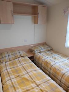 Postel nebo postele na pokoji v ubytování Cozee Stays Holiday Home