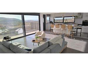 a living room with a couch and a table at Aquarius Luxury Suites in Ólimbos
