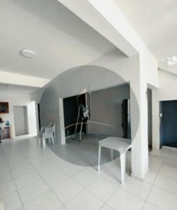 a white room with a table and chairs in it at Imóvel COP30 - Próximo parque da Cidade in Belém