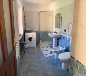 a bathroom with a sink and a toilet and a shower at Moulins 57 in Aymavilles