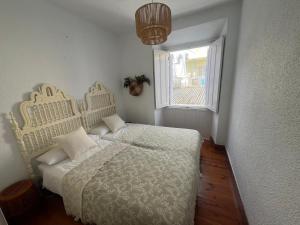 En eller flere senge i et værelse på La Plaza II