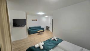 TV a/nebo společenská místnost v ubytování Hotel MM Residence