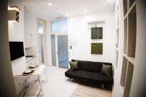 a living room with a couch and a table at B&B Home3 bed in Bisceglie