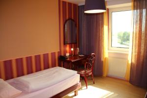 Postel nebo postele na pokoji v ubytování Hotel Freizeittempel