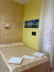 Postel nebo postele na pokoji v ubytování Rome Max house 2
