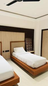 Postel nebo postele na pokoji v ubytování Anantharaa Hotel