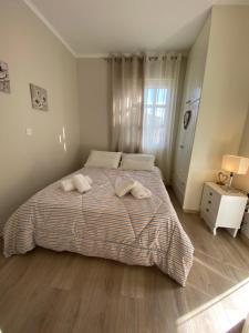 Postel nebo postele na pokoji v ubytování SPYROS APARTMENT