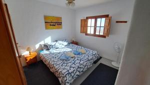 Ένα ή περισσότερα κρεβάτια σε δωμάτιο στο Captivating 2-Bedroom House 'Pajar' Finca Vistamar +14 φωτογραφίες