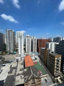 a view of a city skyline with tall buildings at Hotel Mercu Beneficência Portuguesa Bela Vista 1408 in Sao Paulo