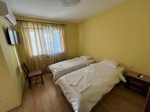 Postel nebo postele na pokoji v ubytování КЪЩА ЗА ГОСТИ Раковска 97