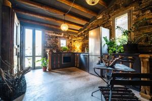 a kitchen with a table and some plants at Casa Ricciardi in Ustica
