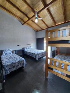 Giường trong phòng chung tại Rancho pescador