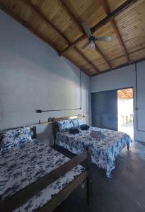 Giường trong phòng chung tại Rancho pescador