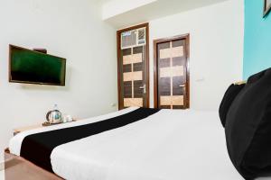 Postel nebo postele na pokoji v ubytování Hotel O KD Plaza 6