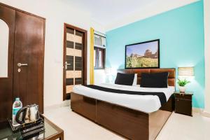 Postel nebo postele na pokoji v ubytování Hotel O KD Plaza 6