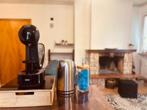 a coffee maker sitting on top of a table at Romeo House in Campo di Giove