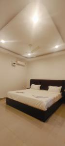 a bedroom with a large bed in a room at Cilantro Agonda in Agonda