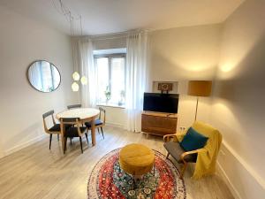 Televízia a/alebo spoločenská miestnosť v ubytovaní Snow White Apartment