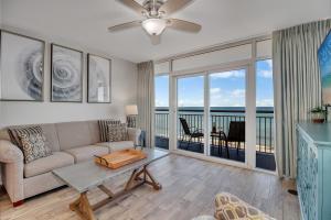 a living room with a couch and a table at Oceanfront Work From Here Central Location! 1157 in Myrtle Beach