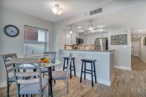 a kitchen and dining room with a table and chairs at Oceanfront Work From Here Central Location! 1157 in Myrtle Beach