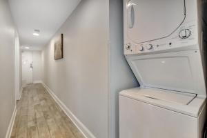 a laundry room with a washer and dryer at Oceanfront Work From Here Central Location! 1157 in Myrtle Beach
