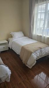 Postel nebo postele na pokoji v ubytování Dahlia