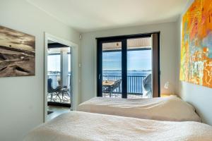 Postel nebo postele na pokoji v ubytování Solara Suite in Kuningatarranta Hanko