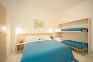 Ένα ή περισσότερα κρεβάτια σε δωμάτιο στο Hotel Lara