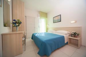 Ένα ή περισσότερα κρεβάτια σε δωμάτιο στο Hotel Lara