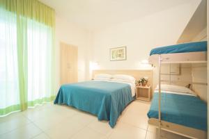 Postel nebo postele na pokoji v ubytování Hotel Lara + 32 fotografií